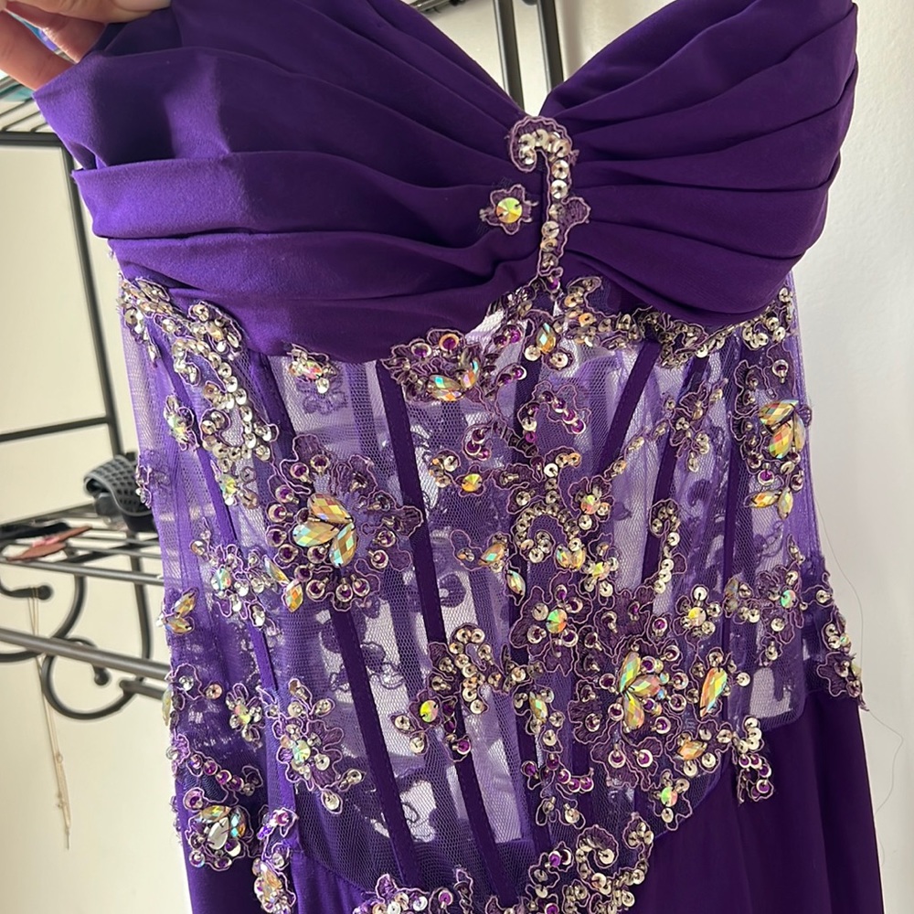 Size 8. Strapless formal wear dress with high side slit.